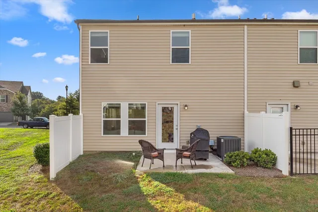 a house view with a seating space and garden