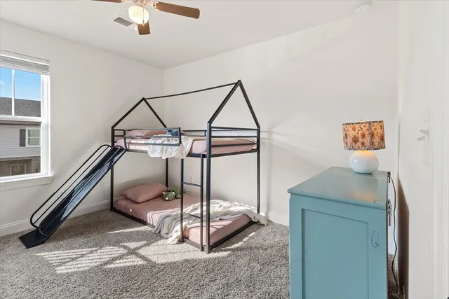 a room that has a bed and a chandelier