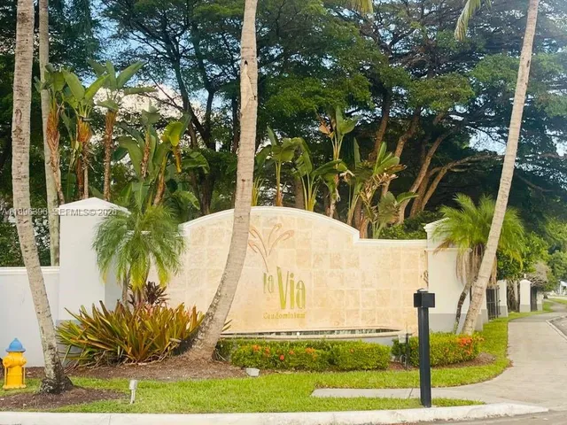a view of potted plants in front of house