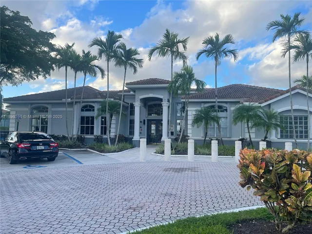 a black car in front of a house