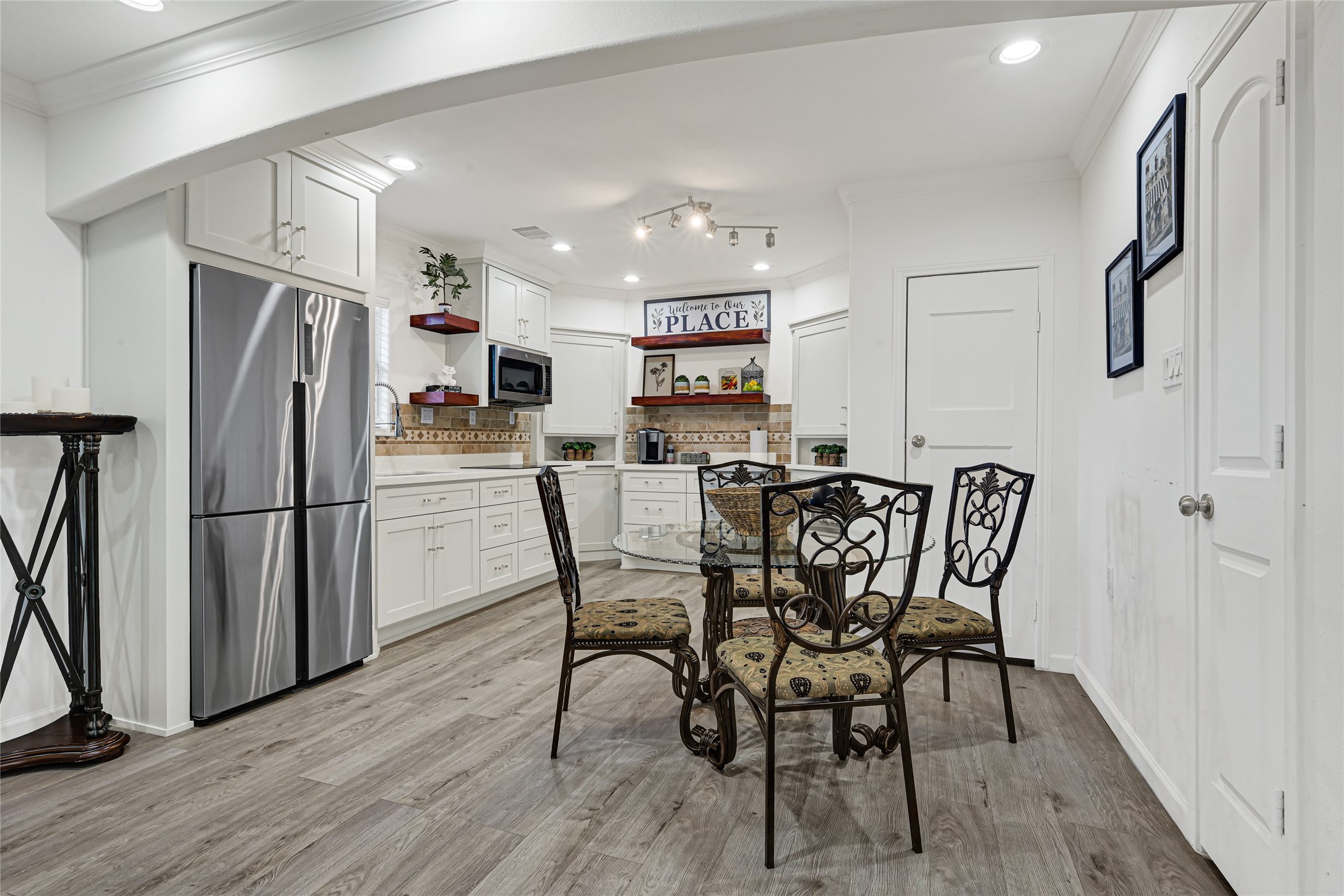 2809 Tooke Street Houston, TX 77023 - Photo 5 of 50 a view of a dining room with furniture and wooden floor