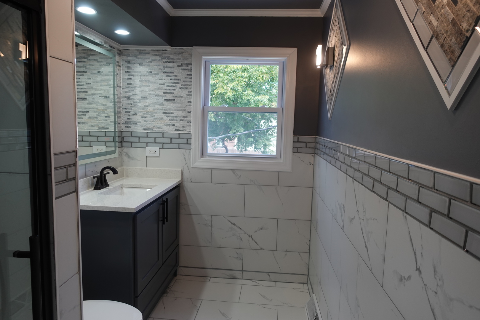 585 Ranger Drive Chicago Heights, IL 60411 - Photo 16 of 48 a bathroom with a sink a toilet and tub