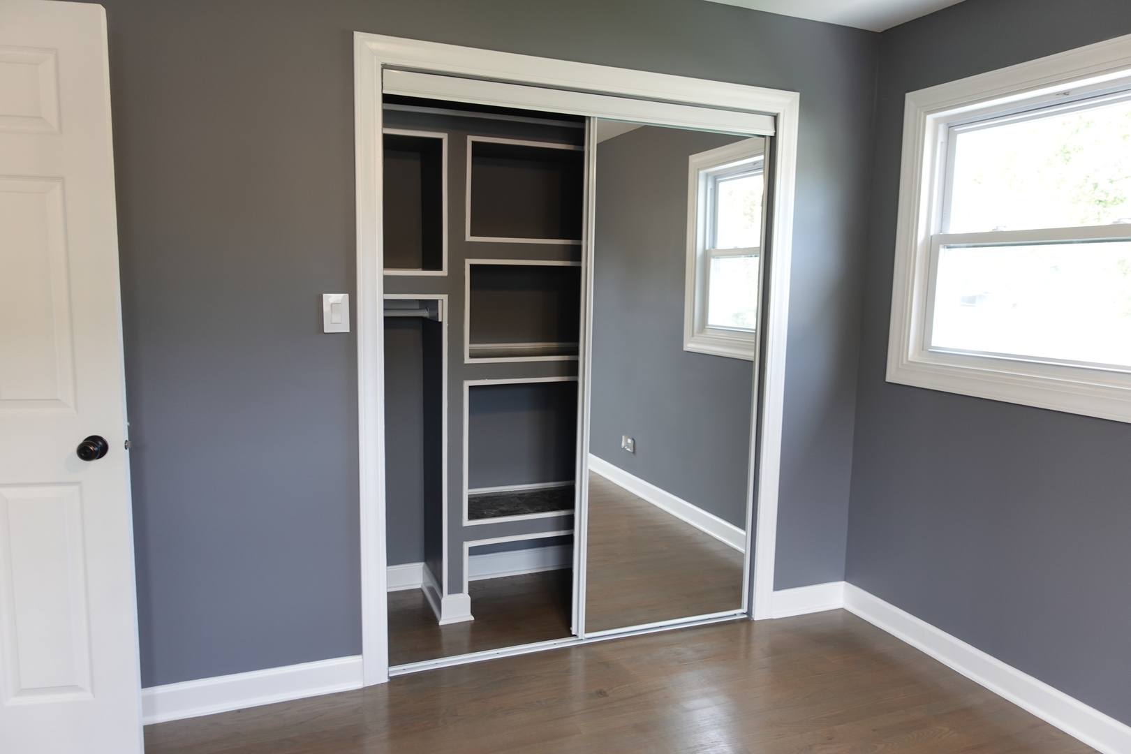 585 Ranger Drive Chicago Heights, IL 60411 - Photo 27 of 48 an empty room with wooden floor and windows