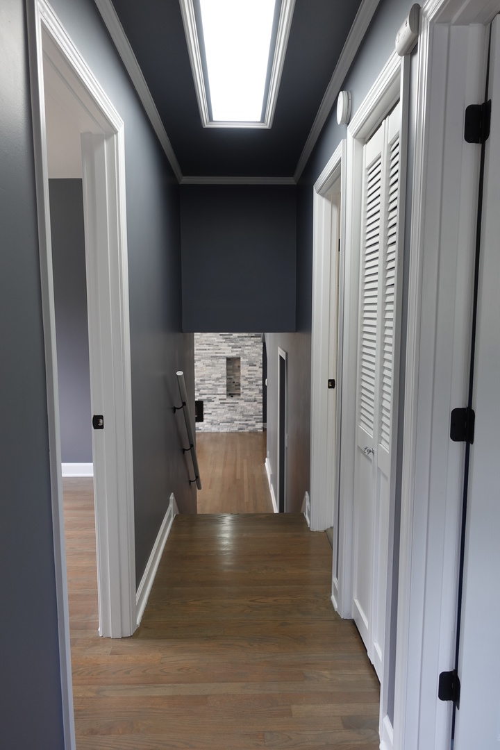 585 Ranger Drive Chicago Heights, IL 60411 - Photo 29 of 48 a view of a hallway with wooden floor and staircase