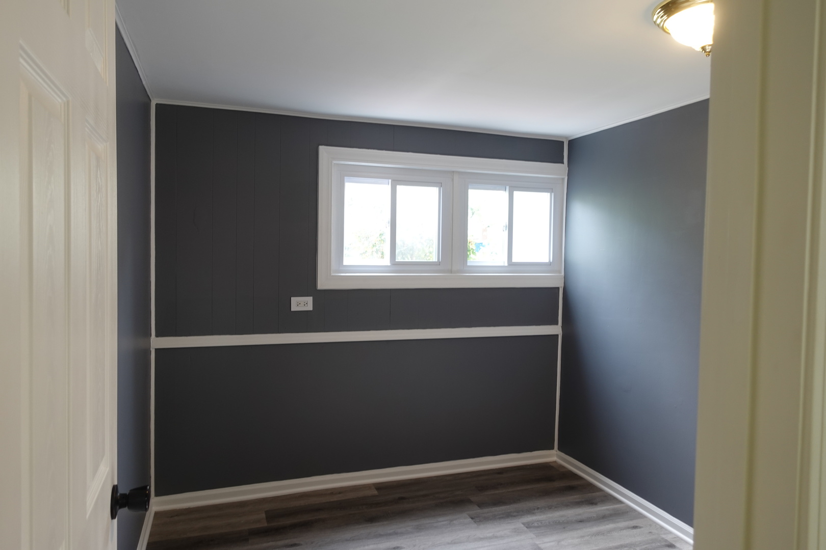 585 Ranger Drive Chicago Heights, IL 60411 - Photo 39 of 48 a view of an empty room with wooden floor and a window