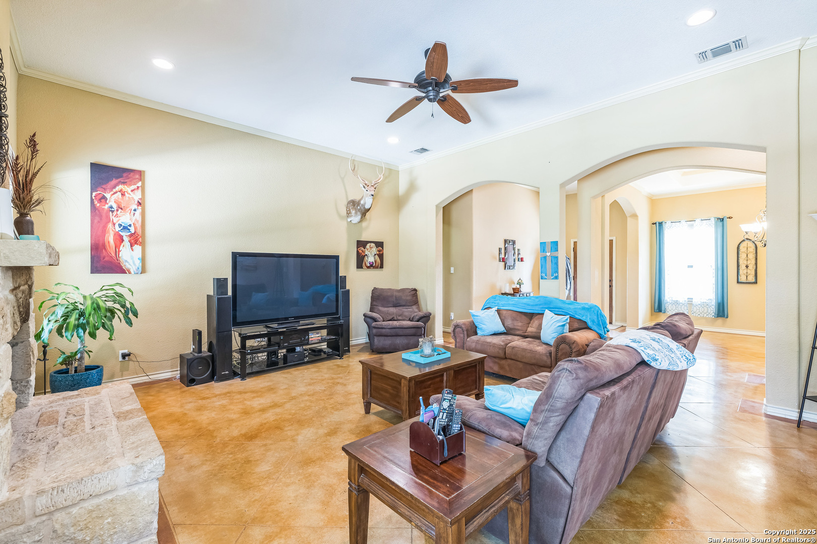 448 Western Bandera, TX 78003 - Photo 11 of 35 a living room with furniture a fireplace and a flat screen tv