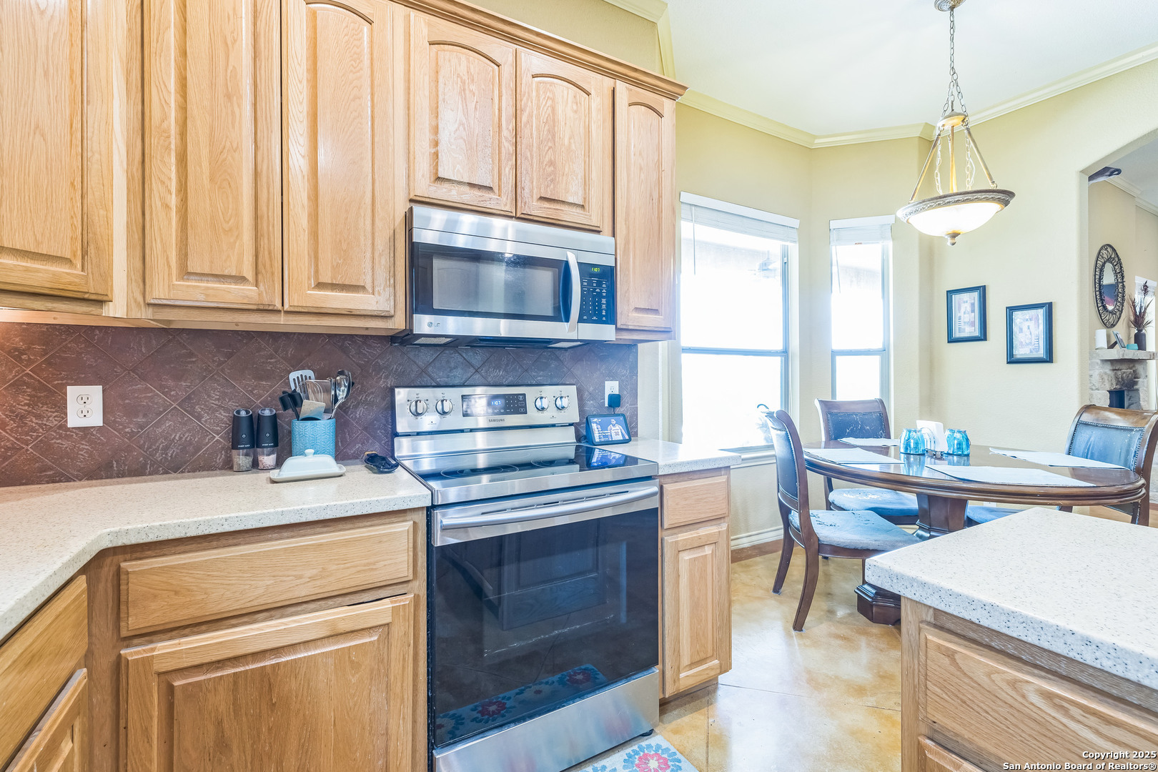 448 Western Bandera, TX 78003 - Photo 16 of 35 a kitchen with stainless steel appliances a stove a sink dishwasher and cabinets with wooden floor