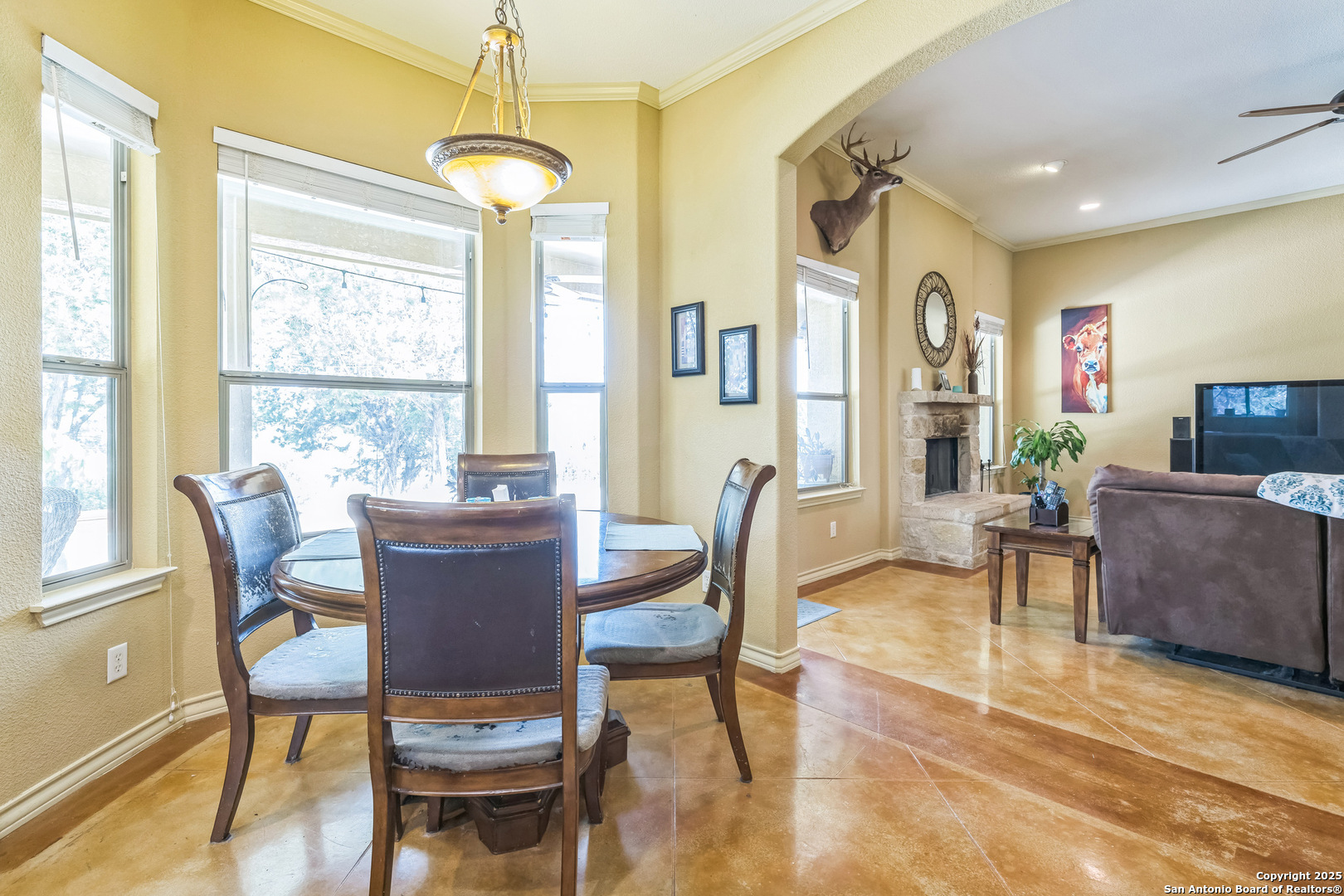 448 Western Bandera, TX 78003 - Photo 18 of 35 a dining room with furniture a chandelier and wooden floor