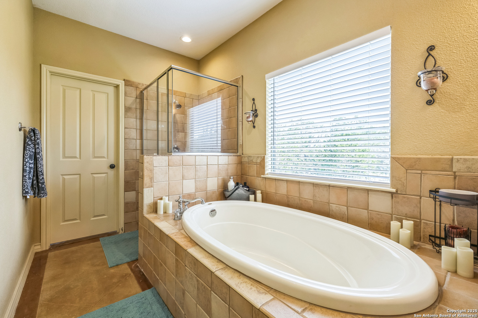 448 Western Bandera, TX 78003 - Photo 25 of 35 a white bath tub sitting in a bathroom next to a window