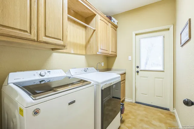 a utility room with dryer and washer