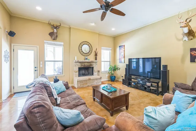 a living room with furniture and a fireplace