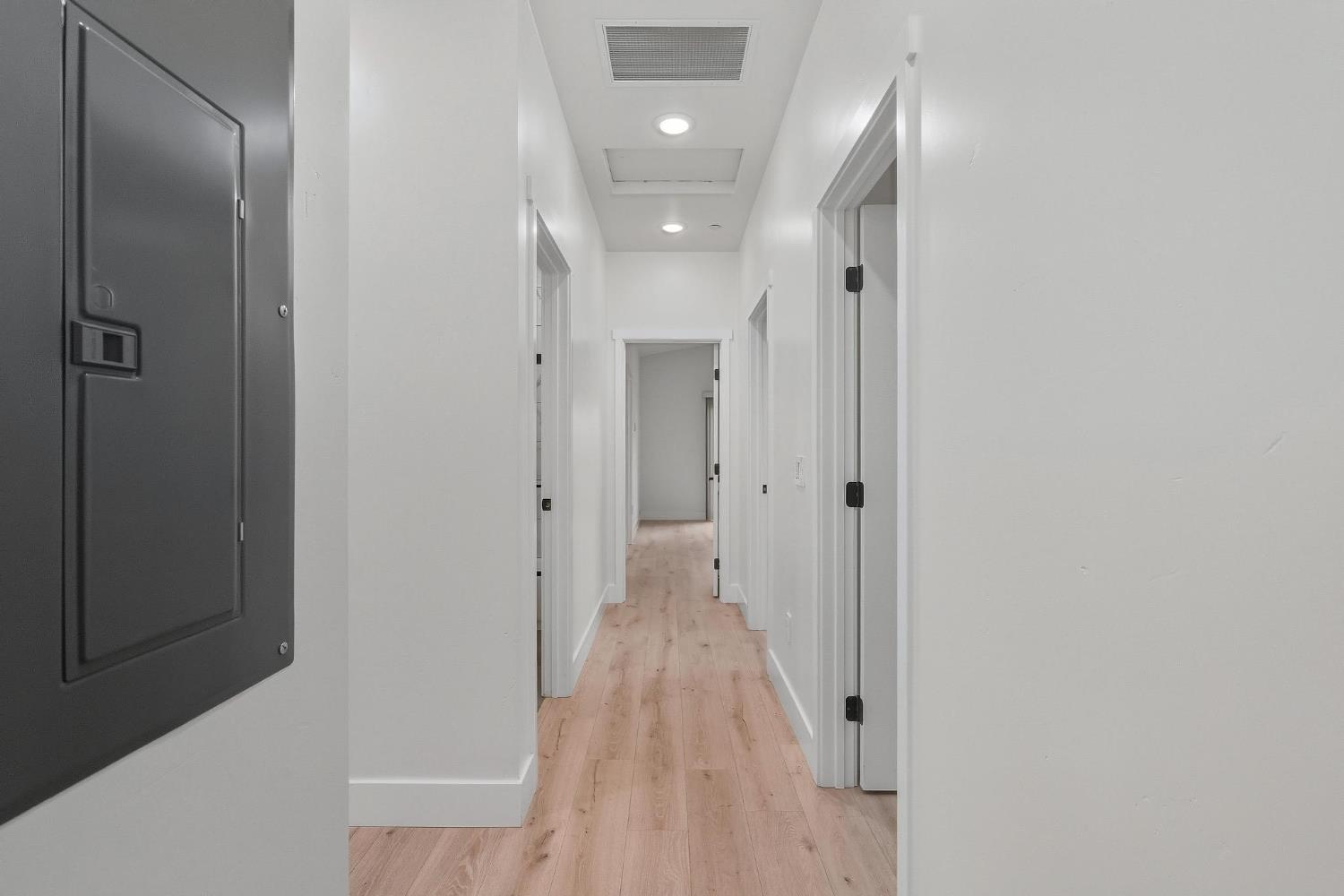 622 North Stockton Avenue Ripon, CA 95366 - Photo 14 of 34 a view of a hallway with wooden floor
