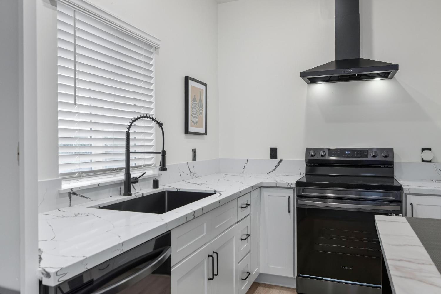 622 North Stockton Avenue Ripon, CA 95366 - Photo 27 of 34 a kitchen with a sink and cabinets