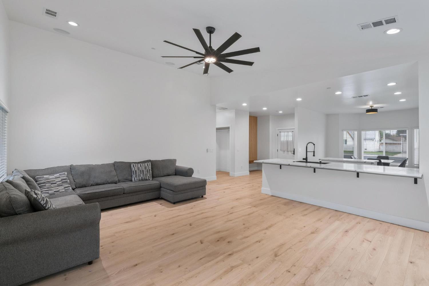 622 North Stockton Avenue Ripon, CA 95366 - Photo 10 of 34 a living room with stainless steel appliances kitchen island furniture and a chandelier