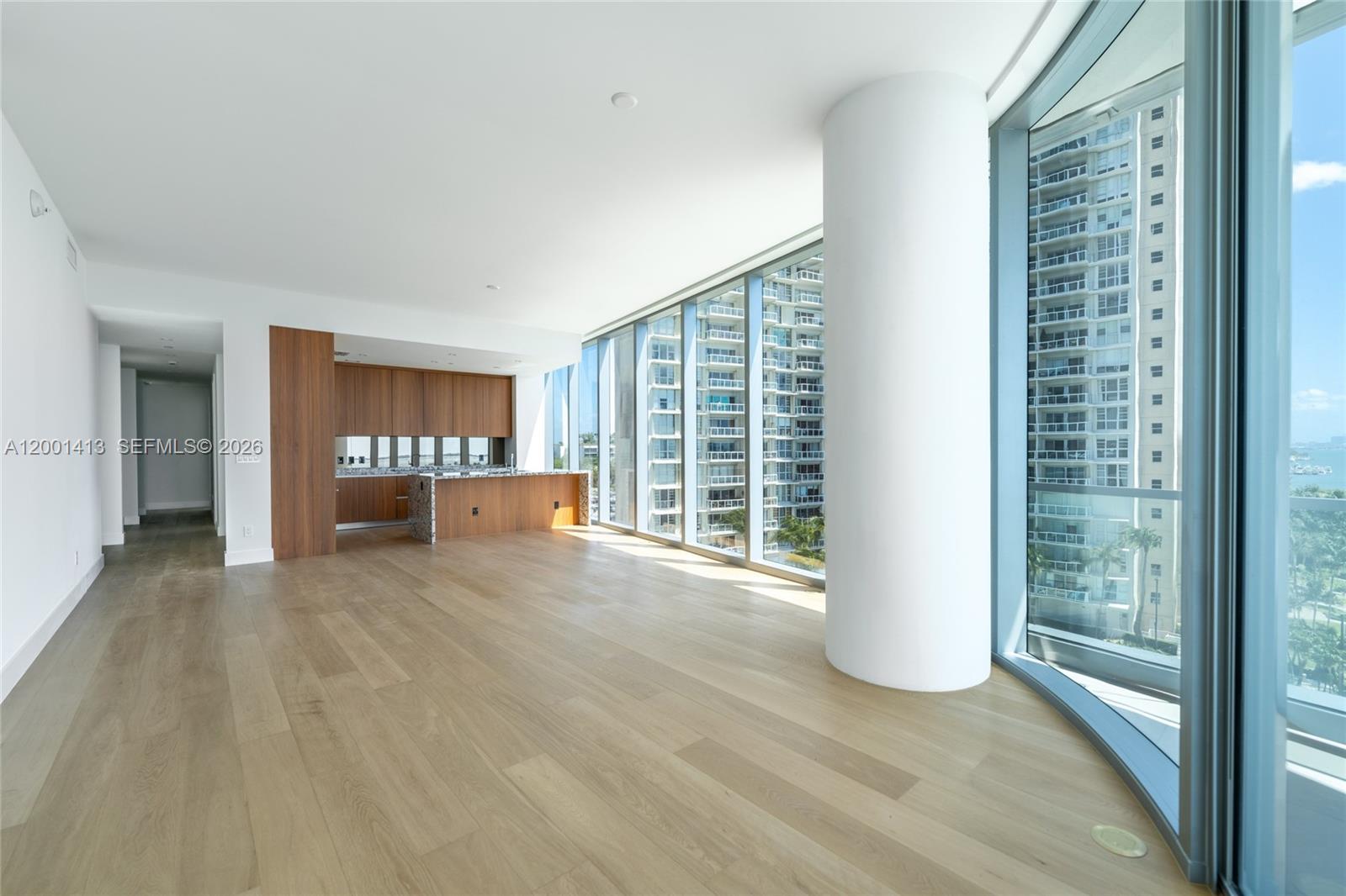 175 Southeast 25th Road, Unit 501 Miami, FL 33129 - Photo 14 of 67 a view of an empty room with a window and wooden floor