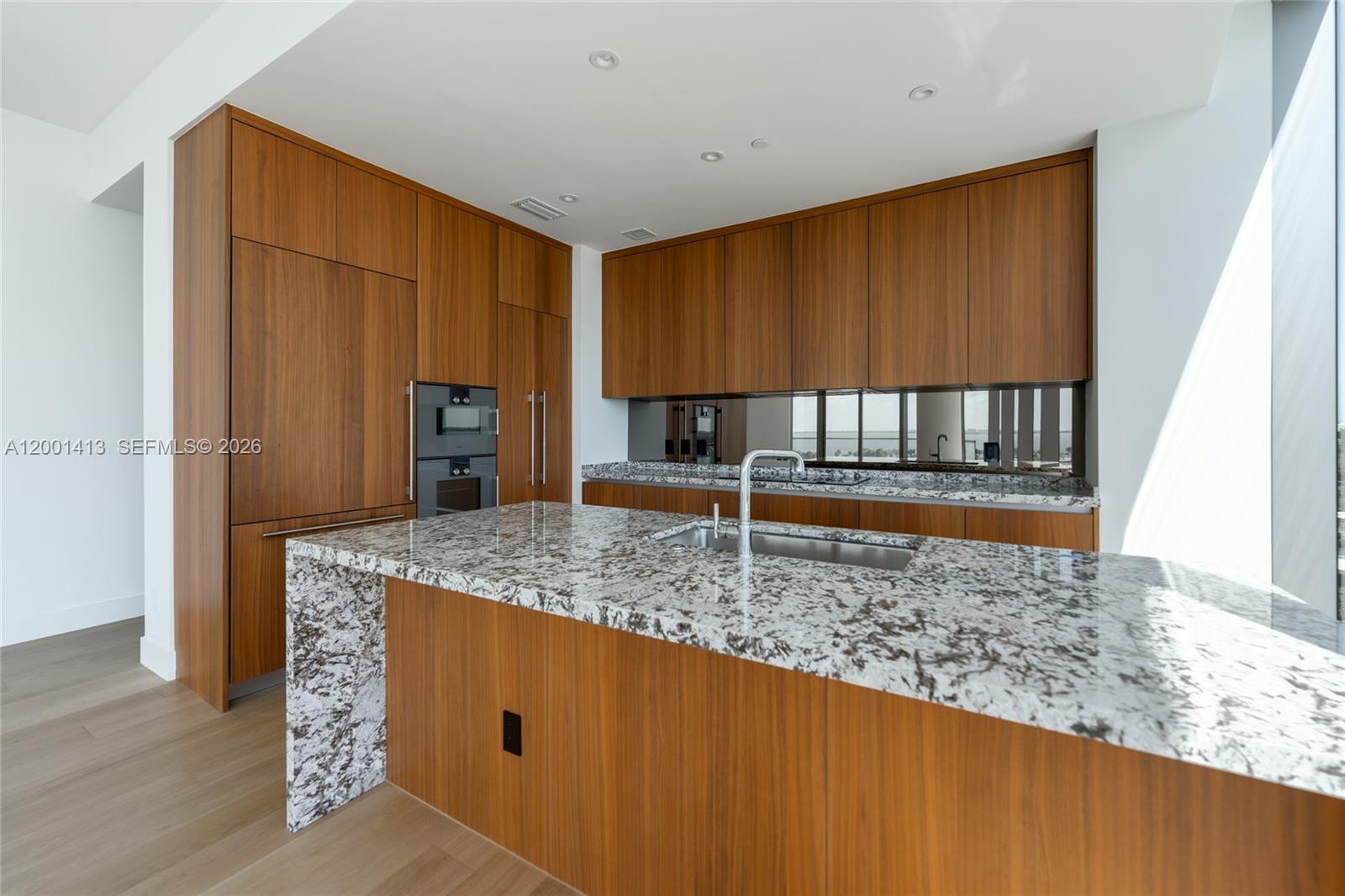 175 Southeast 25th Road, Unit 501 Miami, FL 33129 - Photo 17 of 67 a kitchen with kitchen island a counter top space cabinets and stainless steel appliances