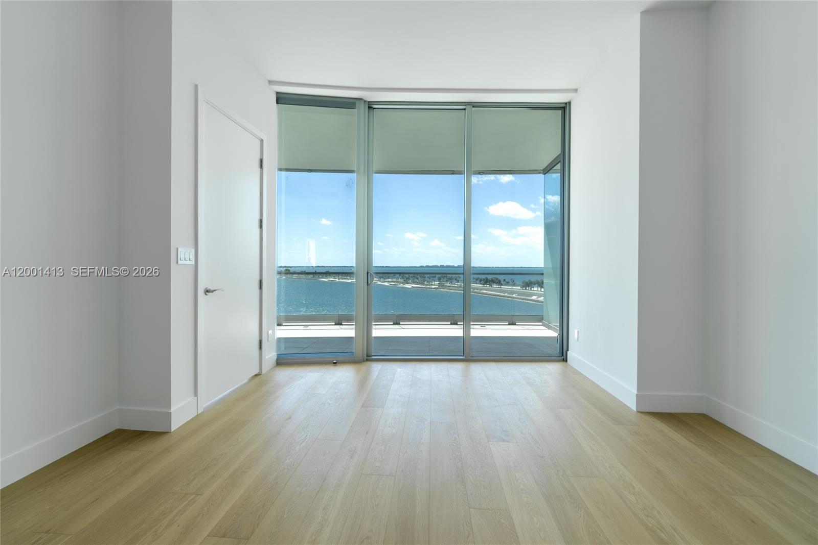 175 Southeast 25th Road, Unit 501 Miami, FL 33129 - Photo 21 of 67 an empty room with wooden floor and outdoor view