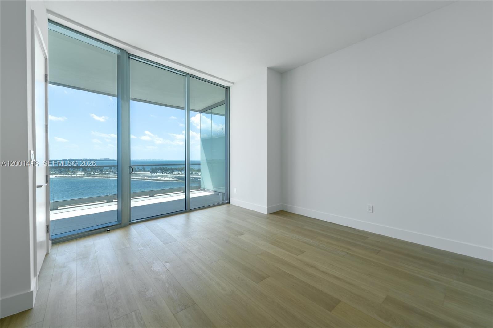 175 Southeast 25th Road, Unit 501 Miami, FL 33129 - Photo 22 of 67 a view of an empty room with wooden floor and a window