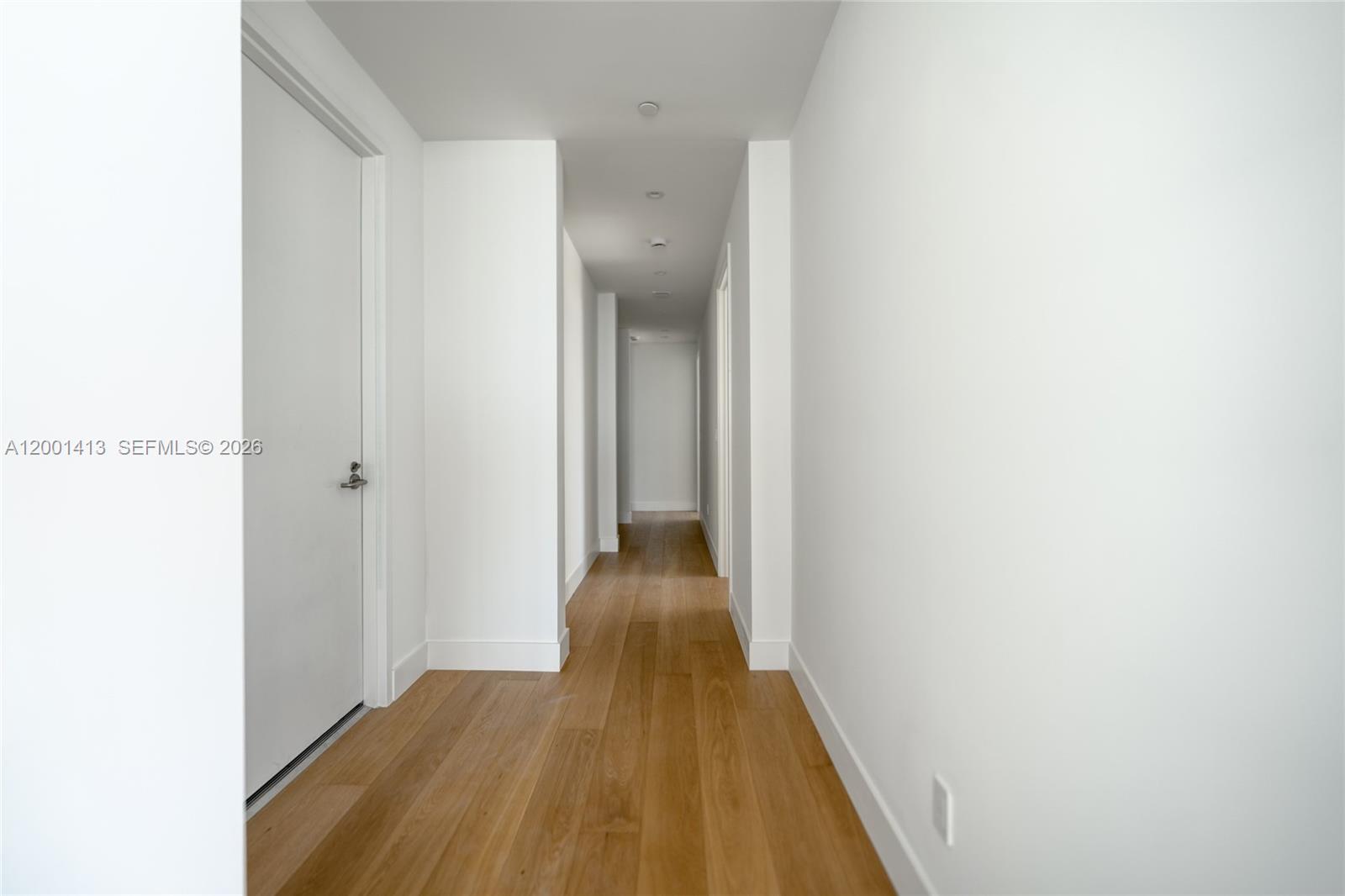 175 Southeast 25th Road, Unit 501 Miami, FL 33129 - Photo 29 of 67 a view of a hallway with wooden floor