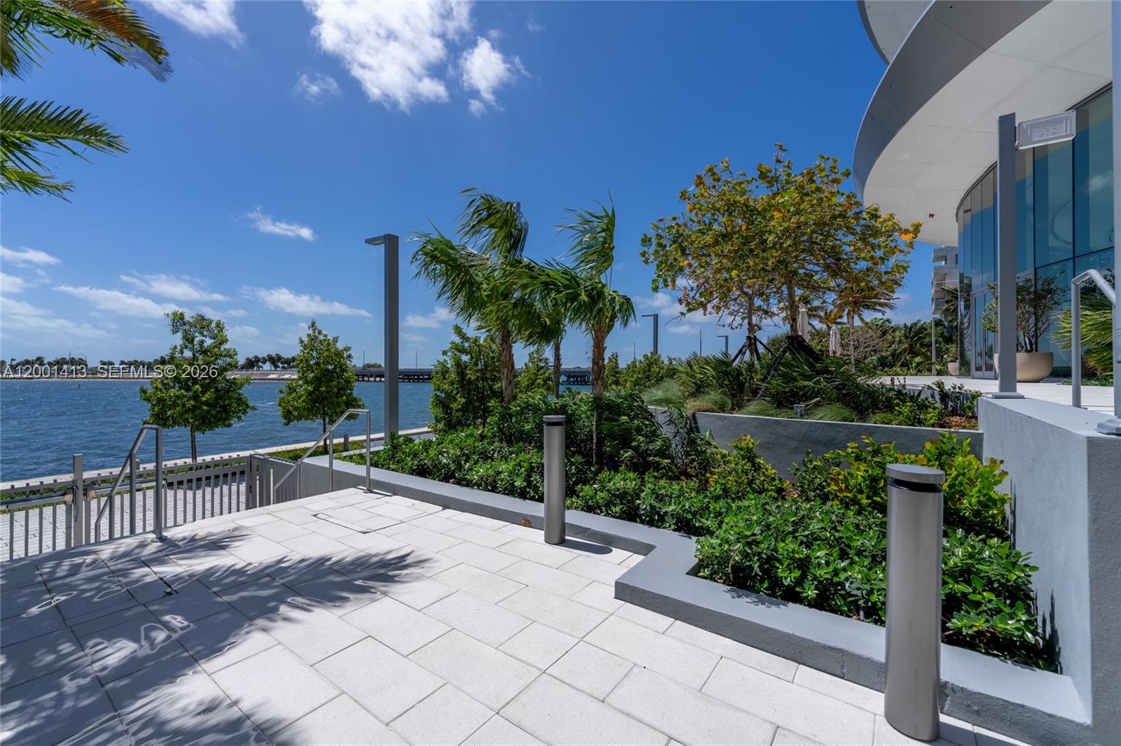 175 Southeast 25th Road, Unit 501 Miami, FL 33129 - Photo 44 of 67 a view of a backyard with potted plants and a fountain