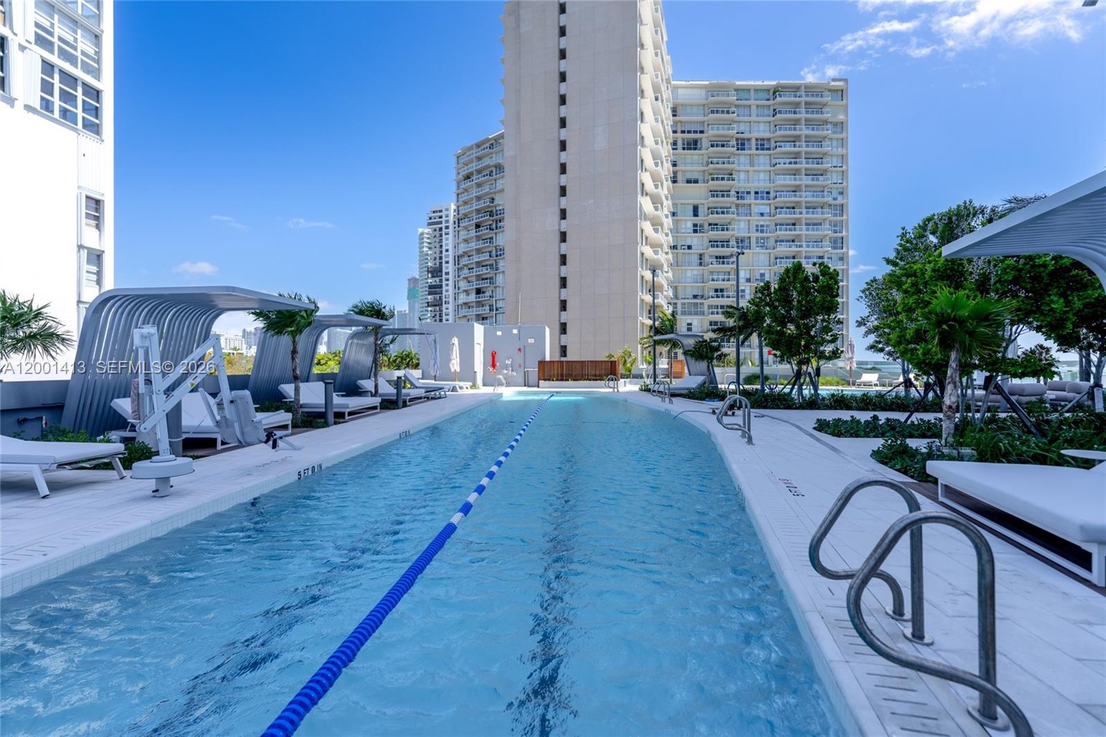 175 Southeast 25th Road, Unit 501 Miami, FL 33129 - Photo 65 of 67 a swimming pool with outdoor seating and yard
