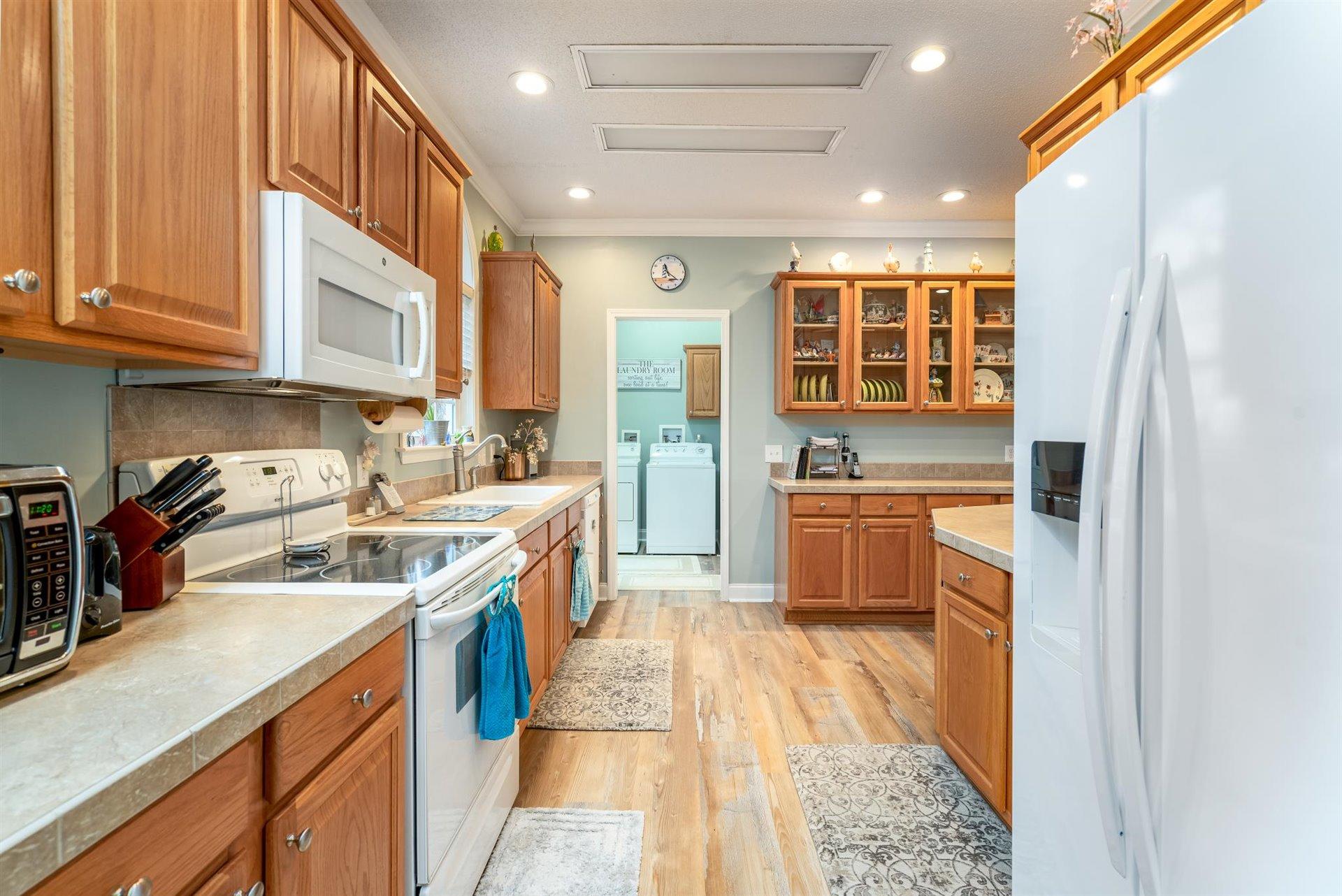 281 Sunny Field Road Wirtz, VA 24184 - Photo 17 of 44 a kitchen with stainless steel appliances granite countertop a stove and a sink