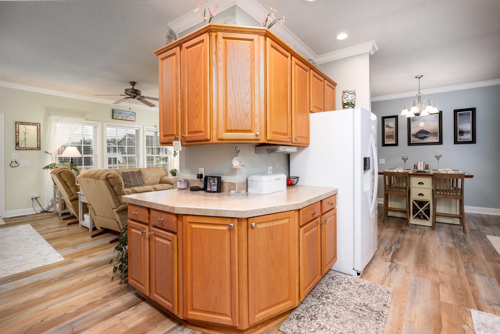 281 Sunny Field Road Wirtz, VA 24184 - Photo 18 of 44 a kitchen with stainless steel appliances granite countertop a refrigerator a sink and a stove with wooden floors