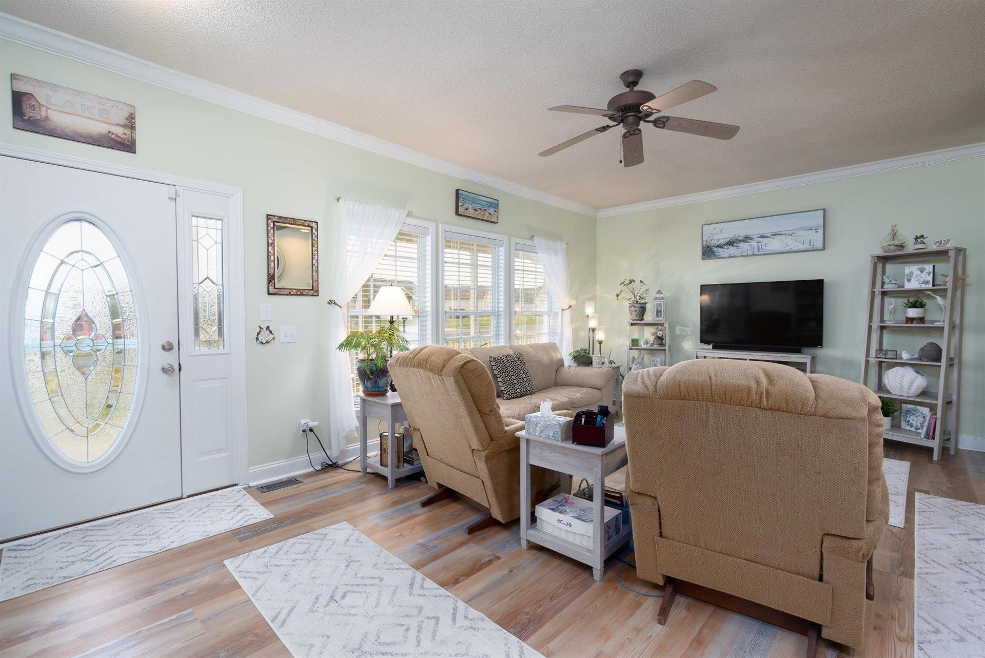 281 Sunny Field Road Wirtz, VA 24184 - Photo 9 of 44 a living room with furniture a flat screen tv and a window