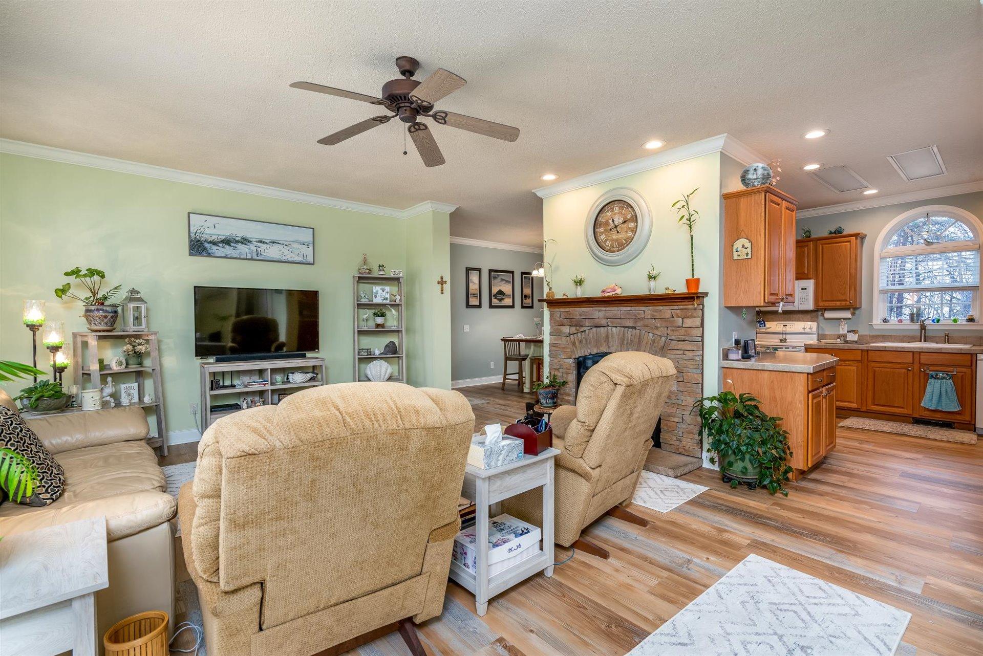281 Sunny Field Road Wirtz, VA 24184 - Photo 10 of 44 a living room with furniture a flat screen tv and a fireplace