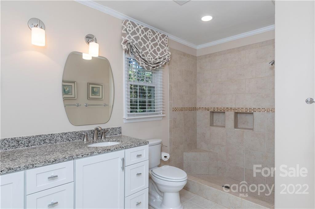 2096 Malvern Road Rock Hill, SC 29732 - Photo 22 of 41 a bathroom with a granite countertop sink a toilet and a mirror