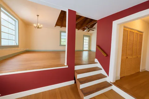 a kitchen with granite countertop a sink and a stove