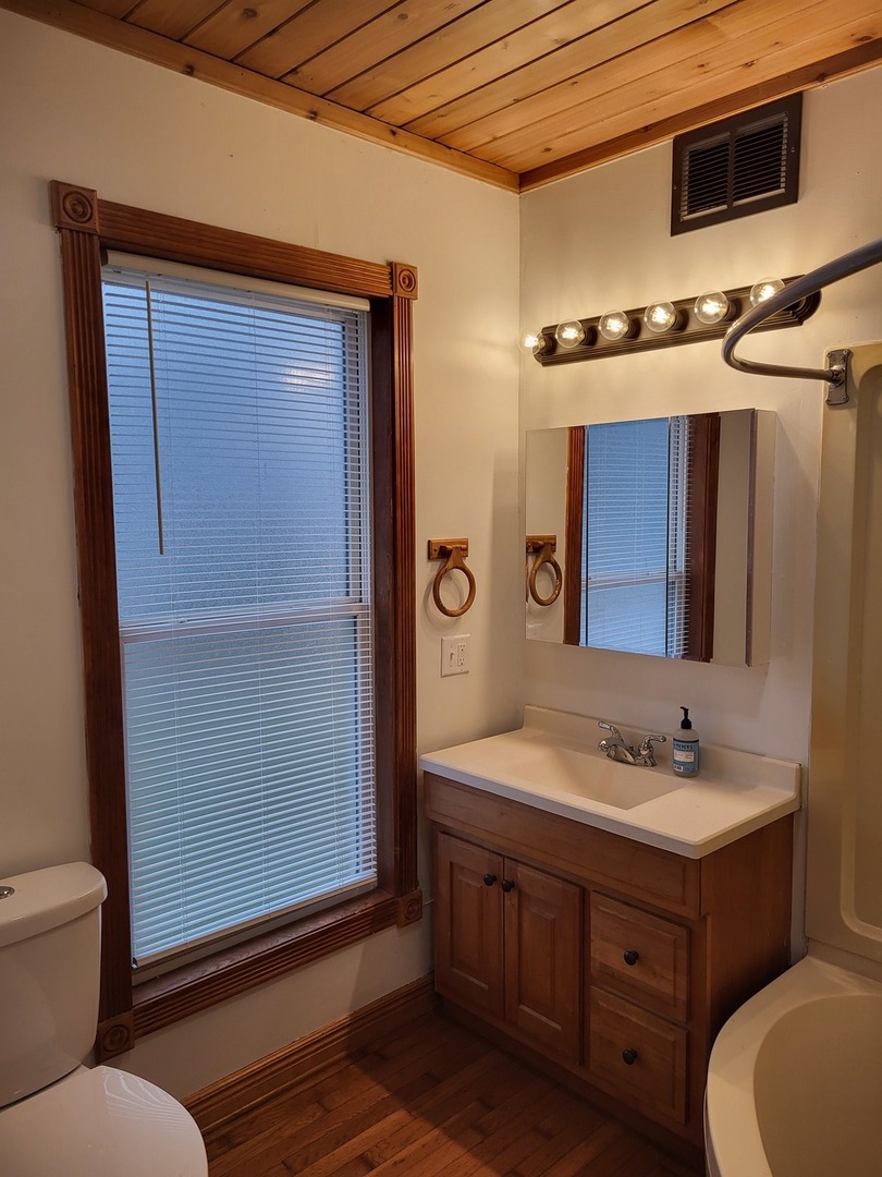 1351 Steward Road Steward, IL 60553 - Photo 14 of 33 a bathroom with a sink a toilet and mirror