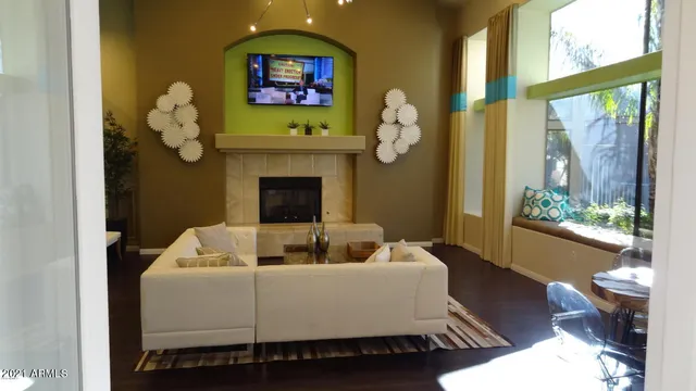 a living room with furniture and a fireplace