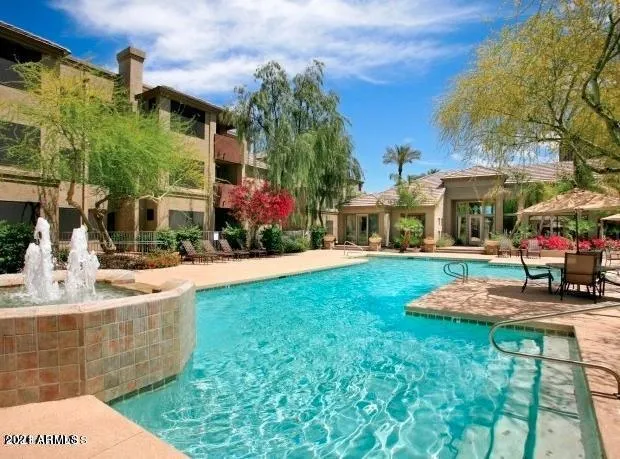 a view of a building with a yard