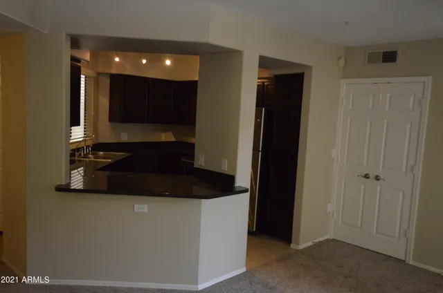 a bathroom with a sink and a large mirror