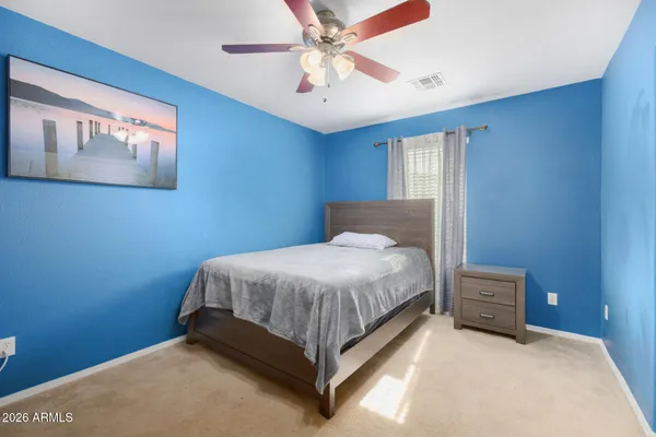 a bedroom with a bed and window