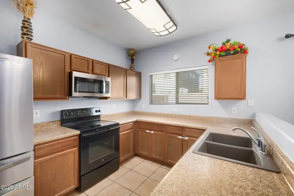 a kitchen that has a sink and a stove