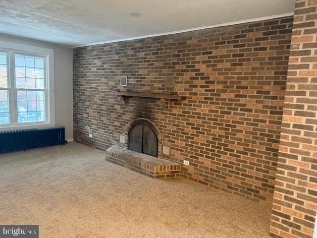 45 Carroll Street Reading, PA 19611 - Photo 2 of 33 Brick Wall in Living Room Fireplace