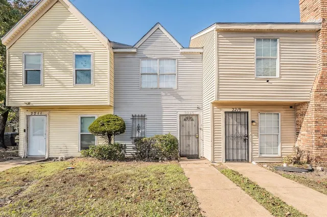 a view of a house with large windows