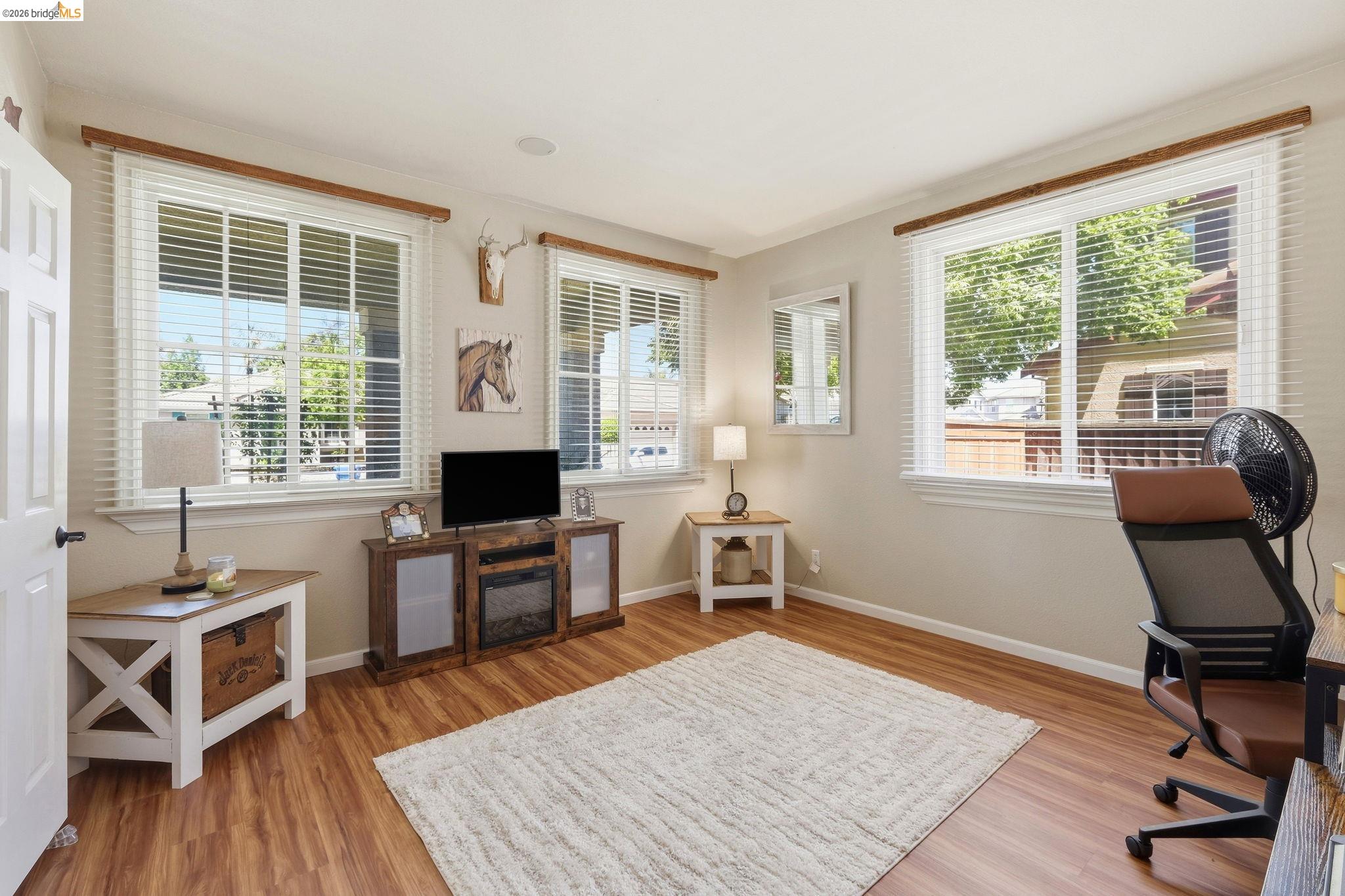 3438 Keystone Loop Discovery Bay, CA 94505 - Photo 14 of 57 a living room with furniture a window and wooden floor
