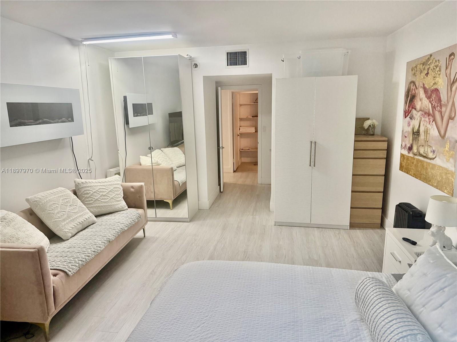 2301 Collins Avenue, Unit 619 Miami Beach, FL 33139 - Photo 4 of 16 a living room with furniture and a couch