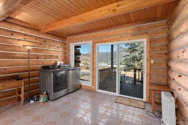 a bedroom with a bed couch and a window