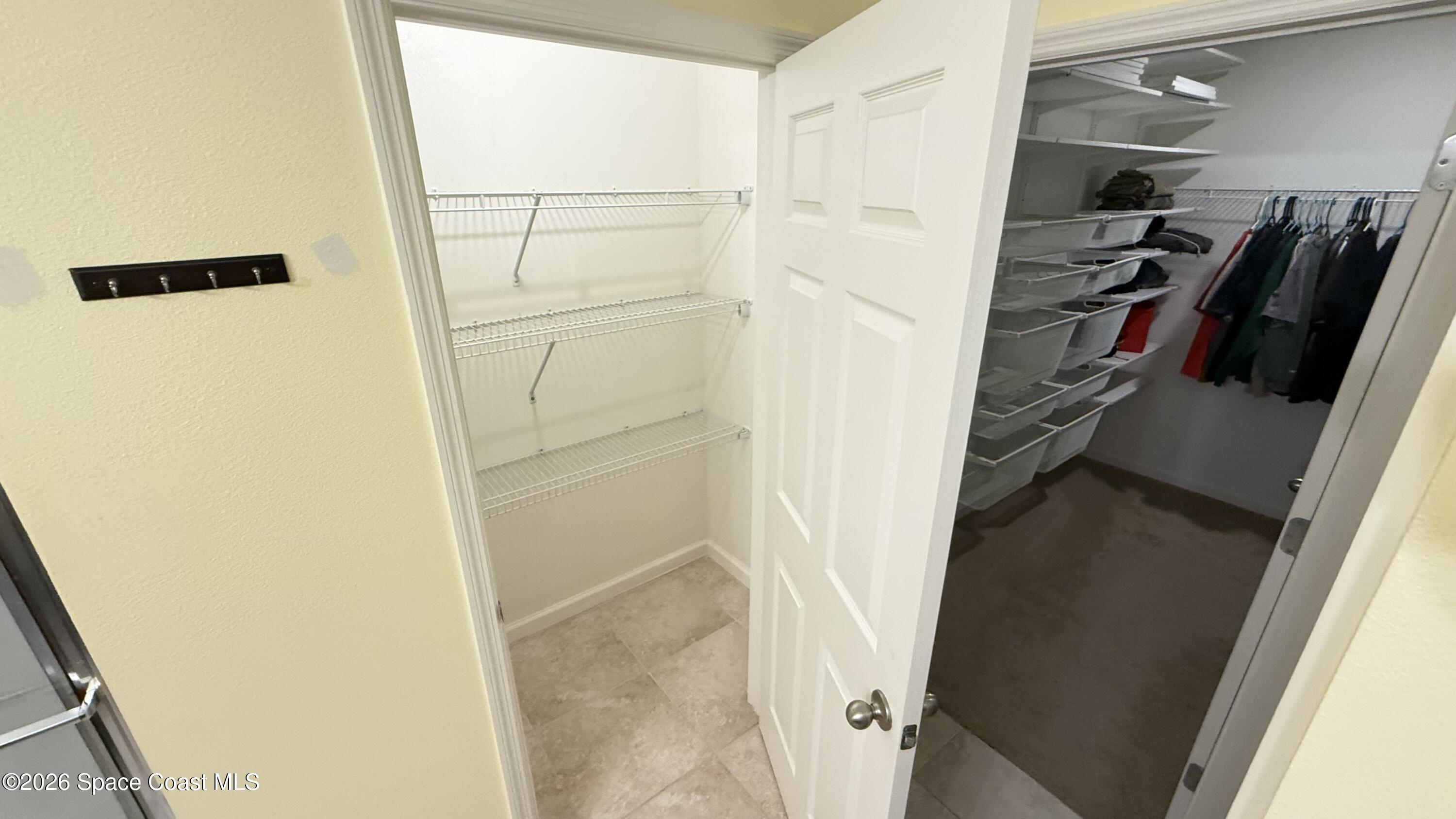 1070 Swiss Pointe Lane Rockledge, FL 32955 - Photo 14 of 24 a view of walk in closet with clothes