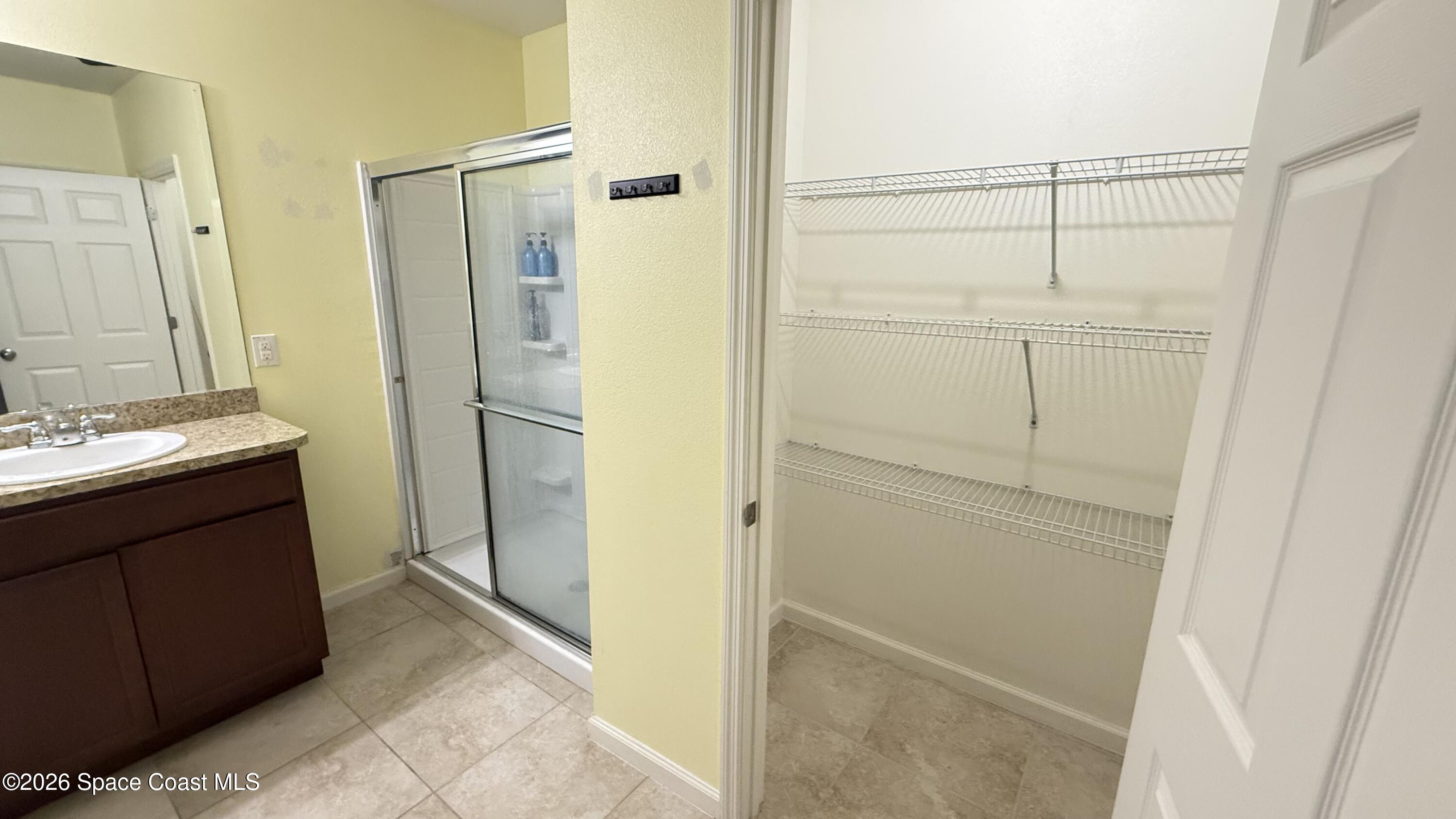 1070 Swiss Pointe Lane Rockledge, FL 32955 - Photo 15 of 24 a bathroom with a shower and a sink