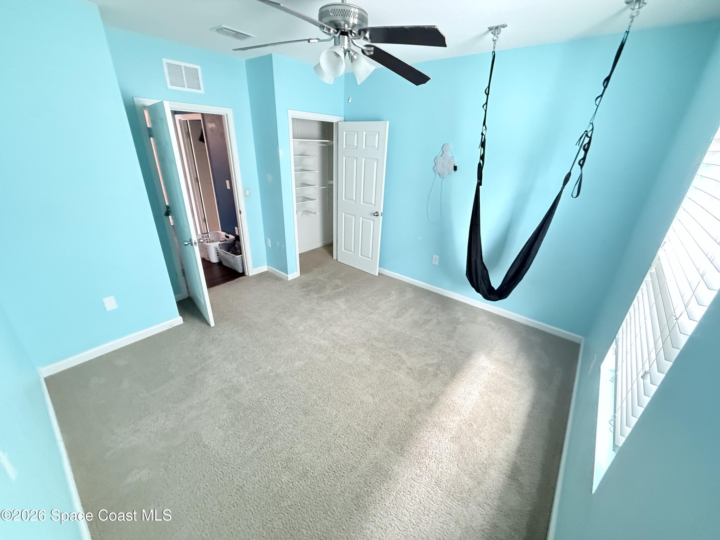 1070 Swiss Pointe Lane Rockledge, FL 32955 - Photo 19 of 24 a view of a hallway with windows