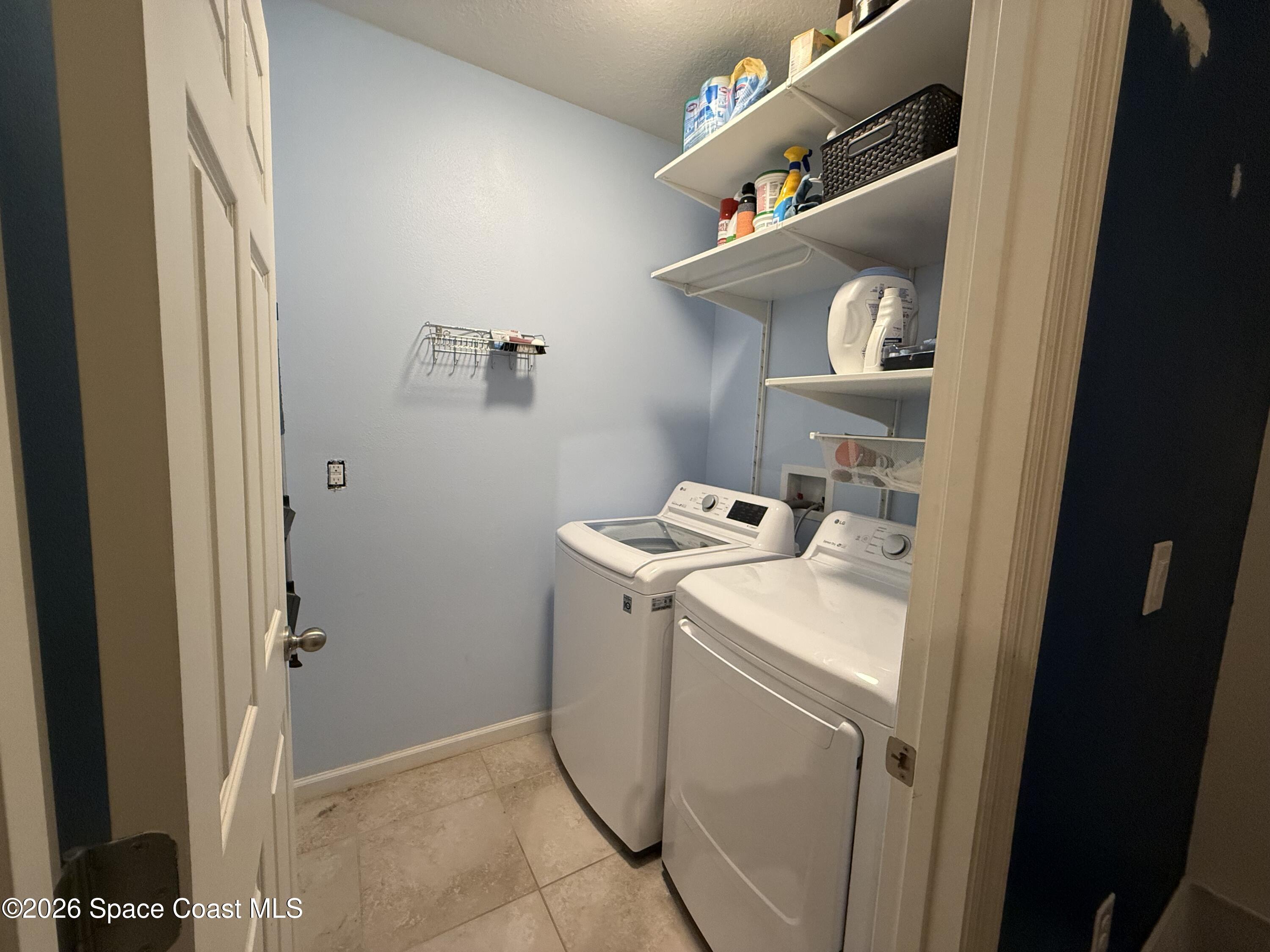 1070 Swiss Pointe Lane Rockledge, FL 32955 - Photo 21 of 24 a utility room with dryer and washer