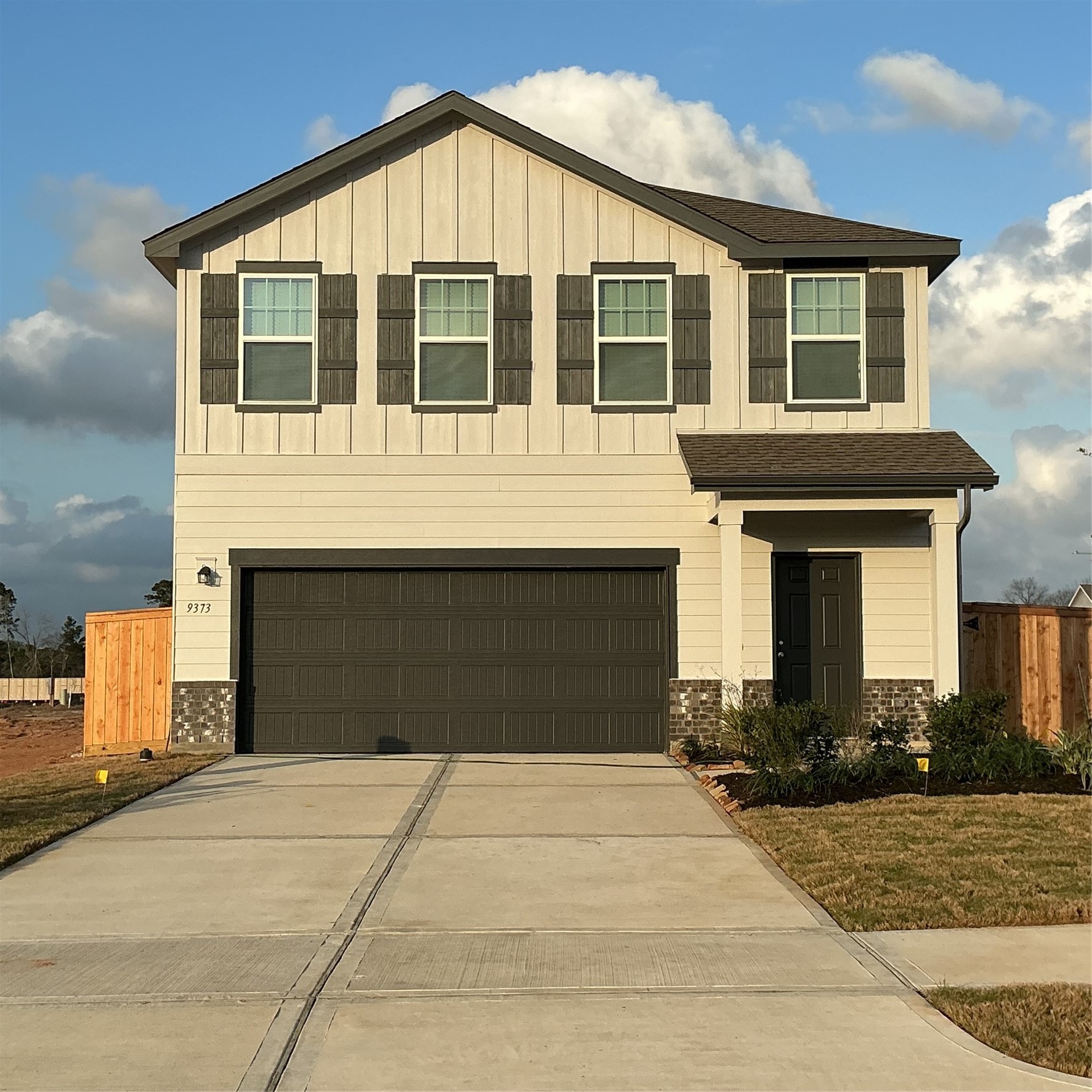 9373 Beryl Lane Conroe, TX 77303 - Photo 1 of 6 a front view of a house with a yard