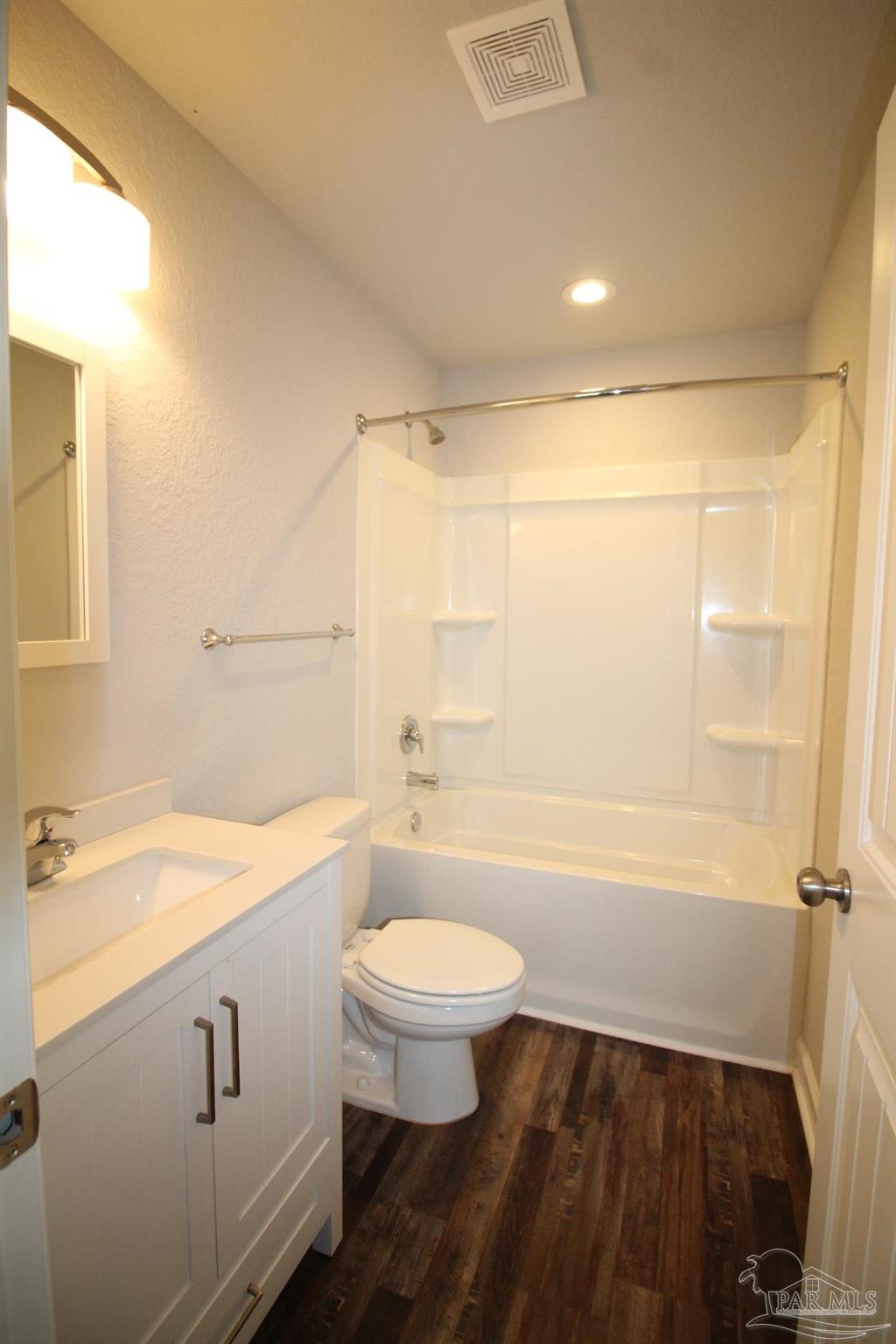 150 South Crow Road, Unit 1501 Pensacola, FL 32506 - Photo 12 of 12 a bathroom with a sink a toilet and shower