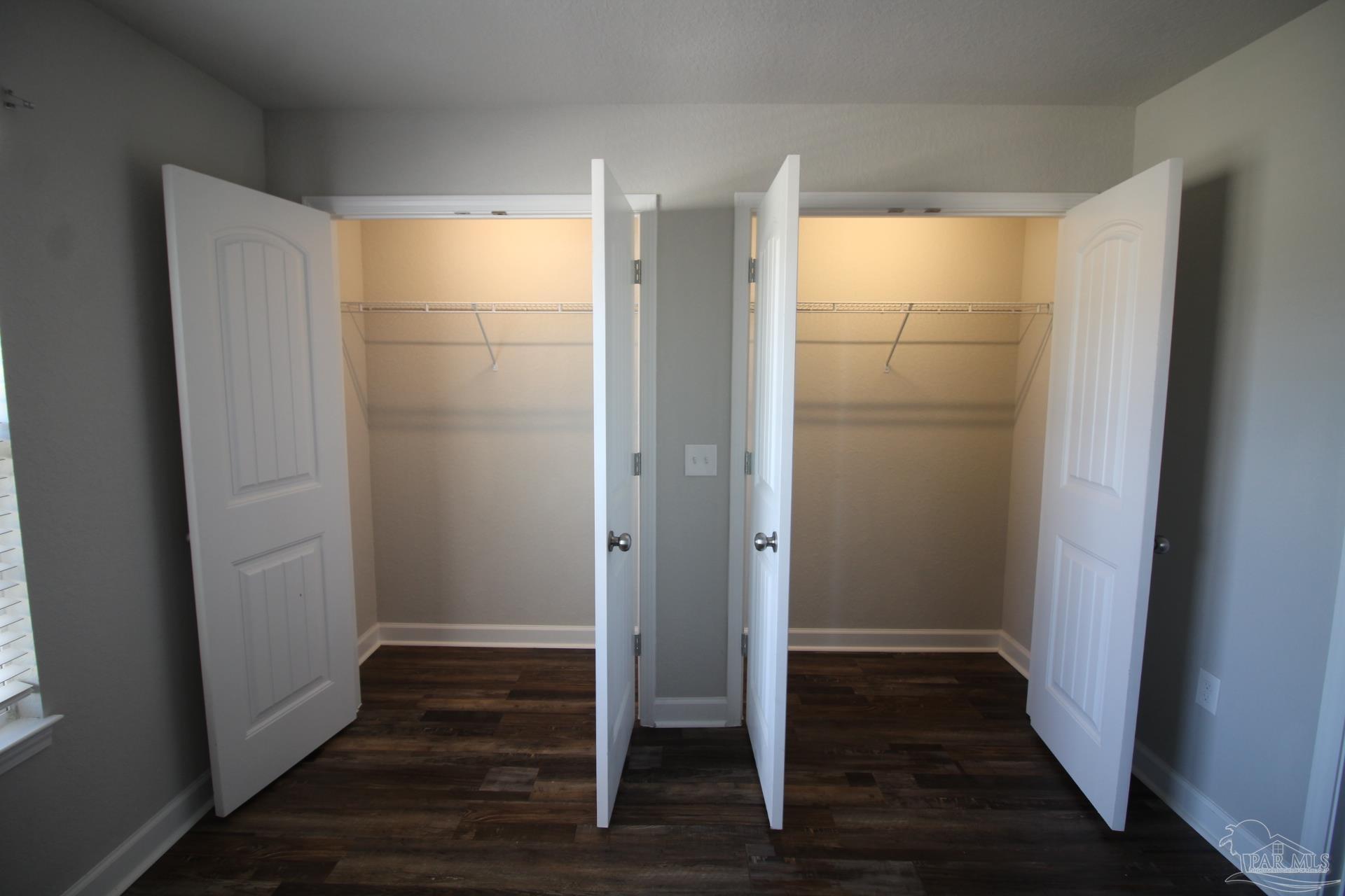 150 South Crow Road, Unit 1501 Pensacola, FL 32506 - Photo 7 of 12 a view of empty room with wooden floor