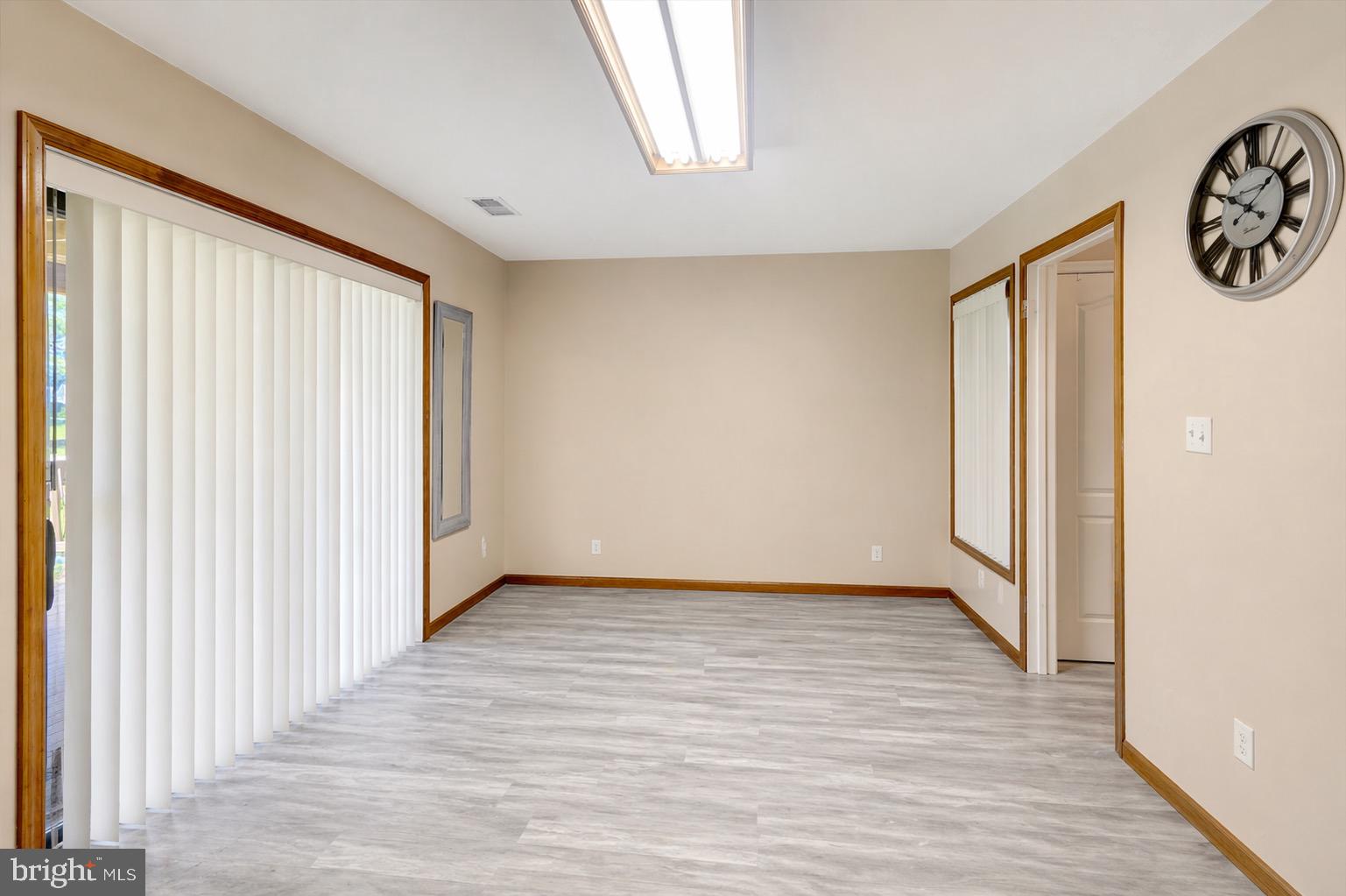 10983 Baskerville Road Reisterstown, MD 21136 - Photo 11 of 21 a view of an empty room with wooden floor